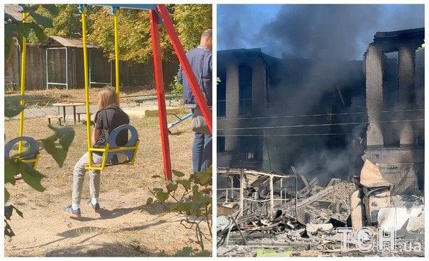 Київ після атаки: дівчинка катається на гойдалці біля будівлі у вогні (відео)